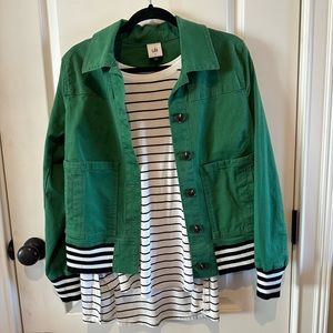Women’s CAbi black and white tank and green jacket